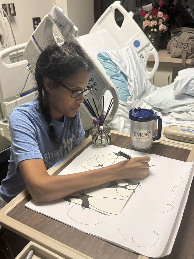Briana drawing neuroart in her hospital room